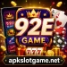 92E Game promotional image showing a smartphone with casino-style games, playing cards, poker chips, slot machine symbols, and the website apkslotgame.net at the bottom.